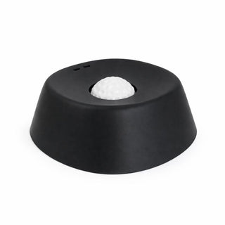 Black dog lick bowl with a white textured center on a white background