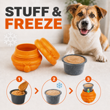 freezable dog treat dispenser filled with yogurt and blueberries