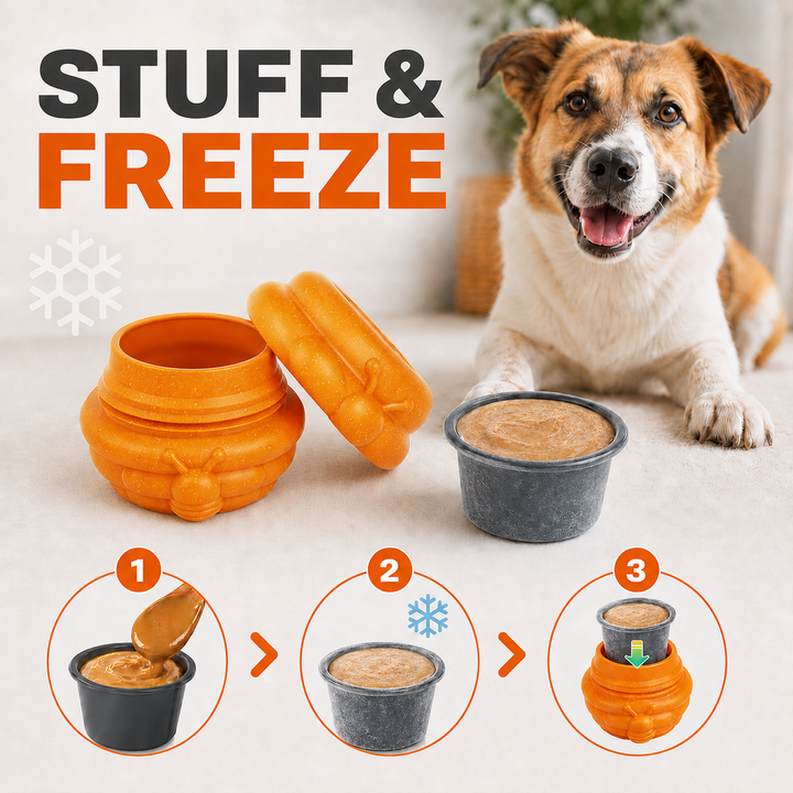 freezable dog treat dispenser filled with yogurt and blueberries